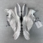 Pair of light gray Balenciaga sneakers, heel and sole view with pull tabs