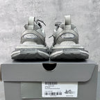 Light gray Balenciaga sneakers with heel branding on the box