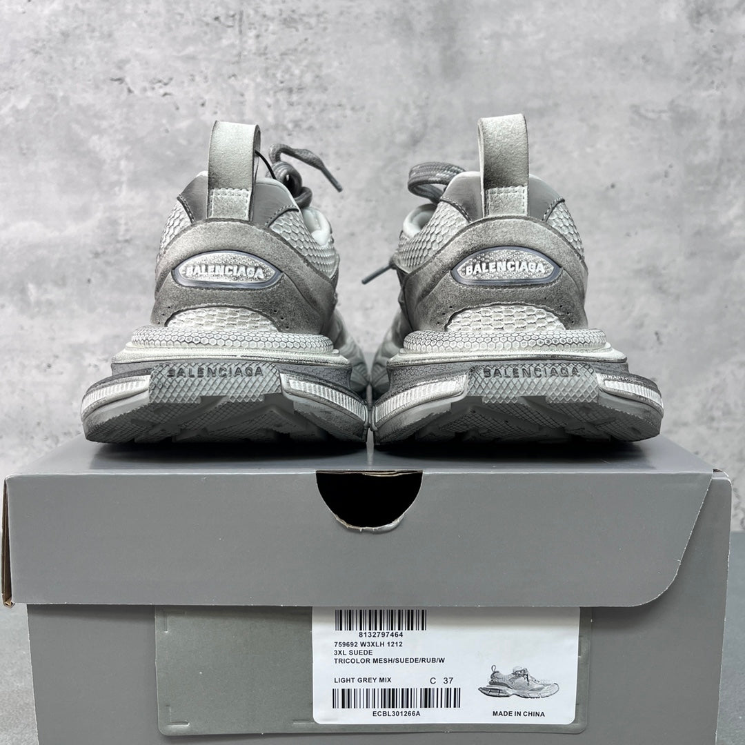Light gray Balenciaga sneakers with heel branding on the box