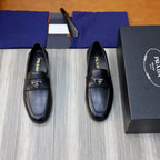 Black leather loafers with Prada triangle emblem, unisex slip-on shoes