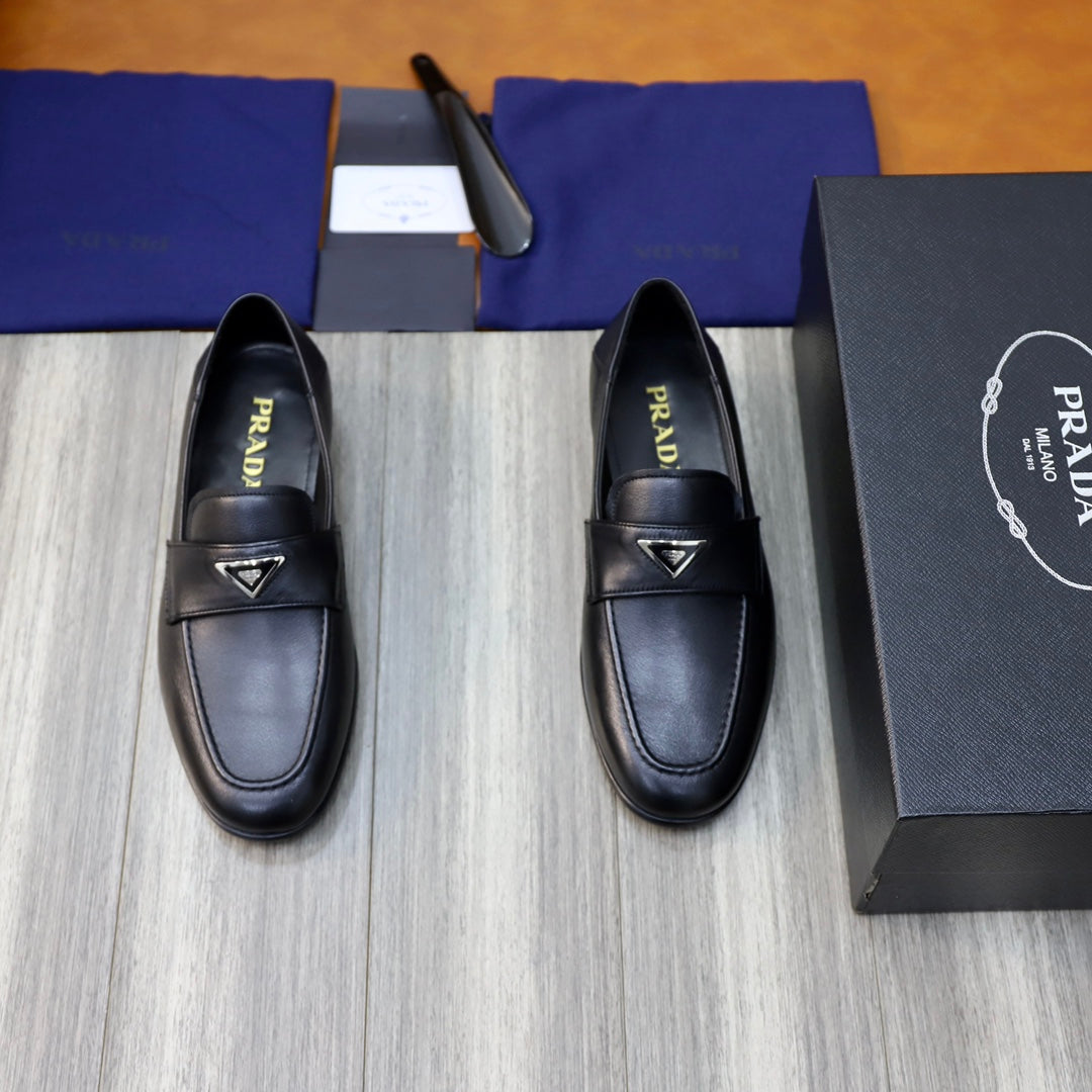 Black leather loafers with Prada triangle emblem, unisex slip-on shoes