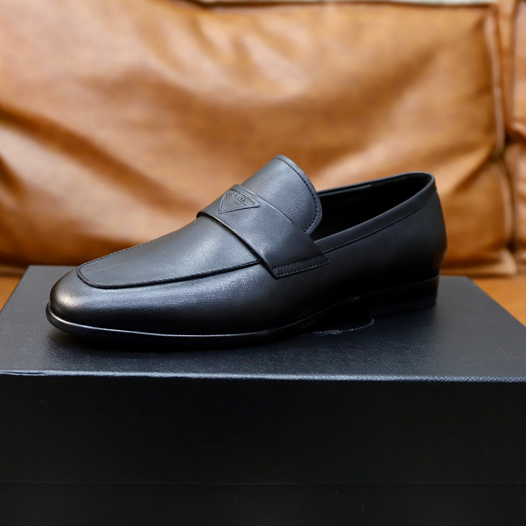 Prada unisex black leather loafer, front-left side view, strap and logo badge