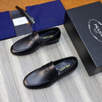Unisex black leather loafers with penny strap, logo on strap center