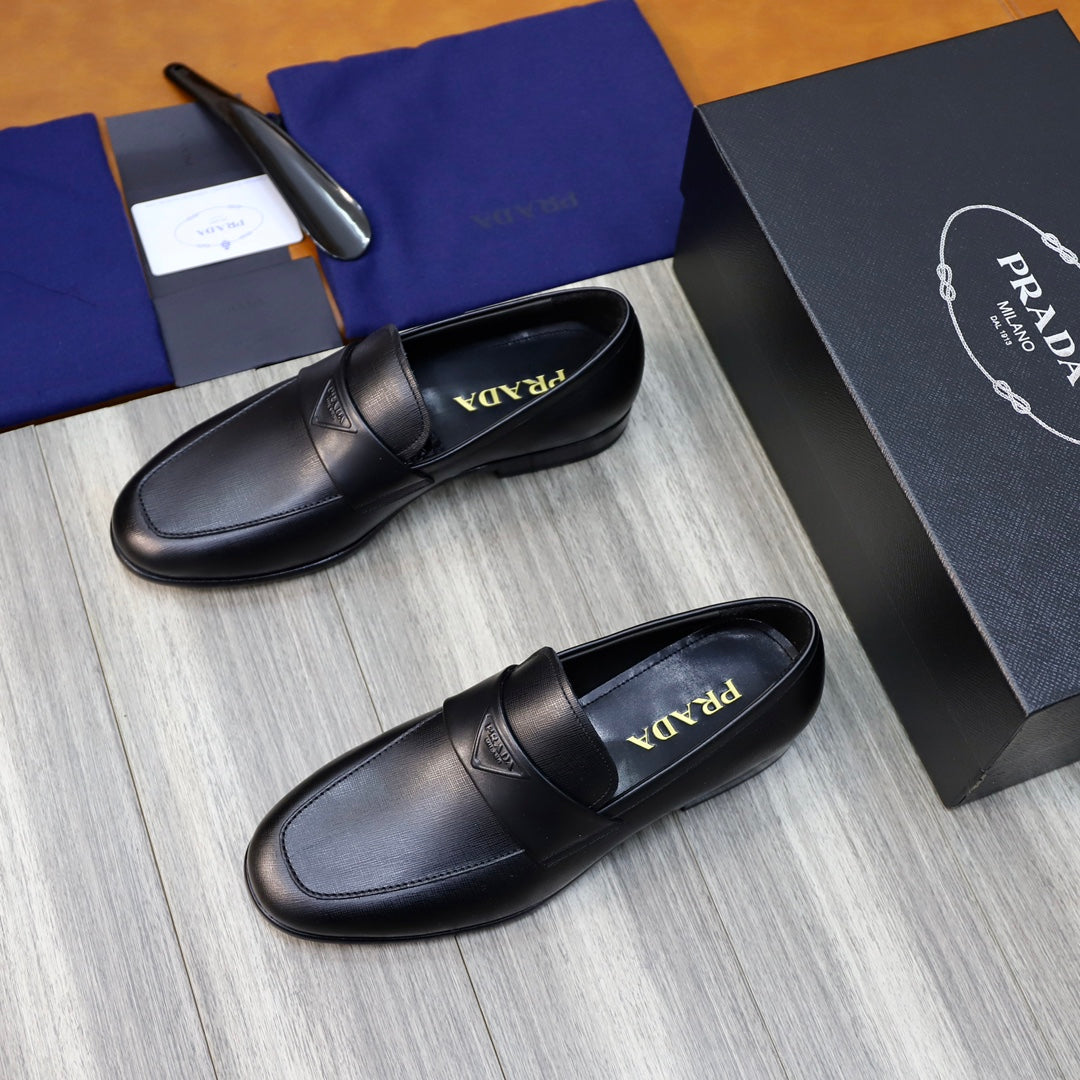 Unisex black leather loafers with penny strap, logo on strap center