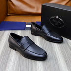 Unisex black leather loafers with strap and square toe, presented as a pair