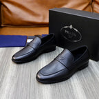 Unisex black leather loafers with strap detail and embossed logo, side-front view