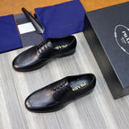 Prada black leather lace-up shoes, top view with logo on socklining