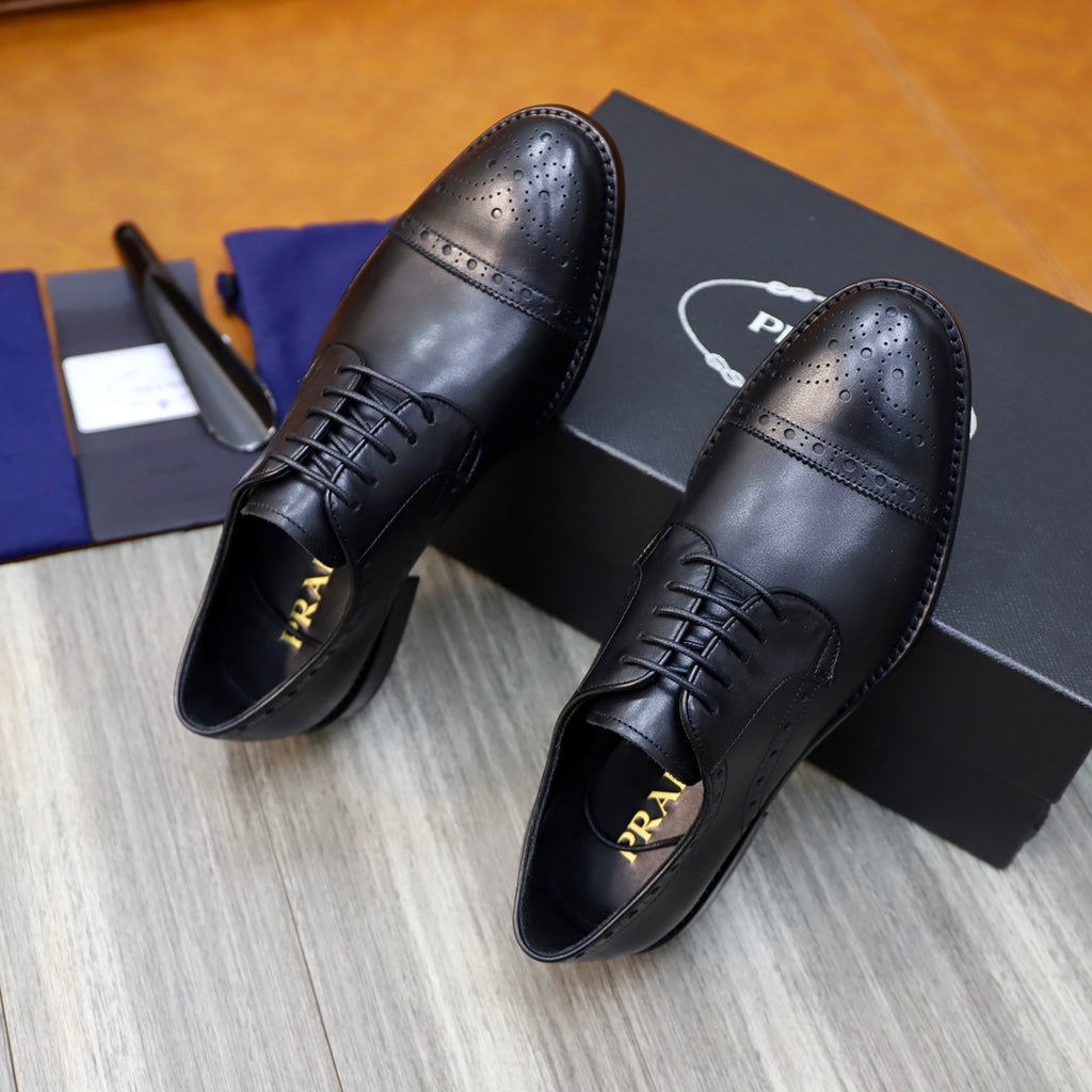Prada black leather lace-up shoes, perforated toe cap and stitched sides