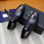 Prada black leather lace-up shoes, perforated toe cap and stitched sides