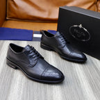 Black leather lace-up oxford shoes with wingtip/brogue styling, Prada