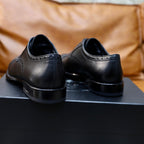 Black leather lace-up shoes, back heel view with low stacked sole, Prada