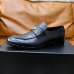 Prada unisex black leather loafer, close side profile with metal-triangle logo