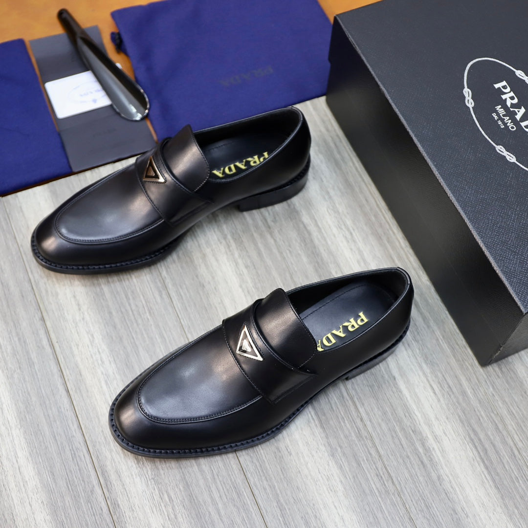 Prada unisex black leather loafers, two-pair view with logo strap and contrast stitching