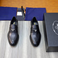 Prada unisex black leather loafers, slip-on with metal-triangle logo strap