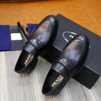Prada unisex black leather loafers, side view showing padded strap and insole branding
