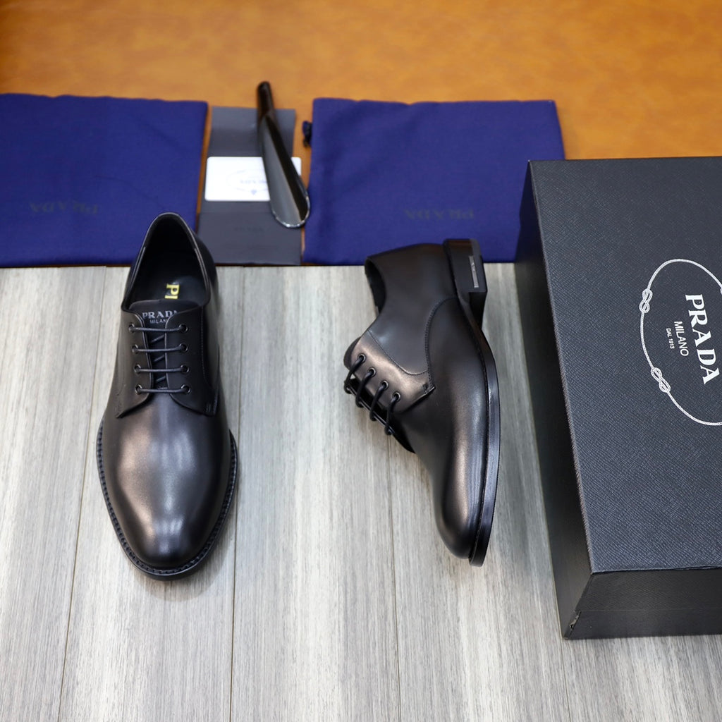 Black leather lace-up oxford shoes, side view on display