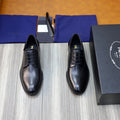 Black leather lace-up oxford shoes with rounded toe and slim sole