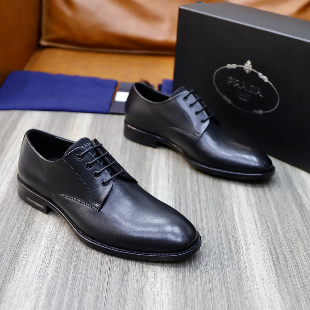 Pair of black leather lace-up oxford shoes with low profile sole