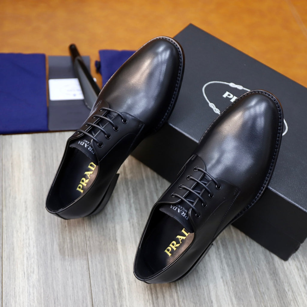 Black leather lace-up oxford shoes with stitched panels and low sole