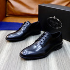 Prada unisex lace-up oxfords in dark shiny leather, angled view and black laces.