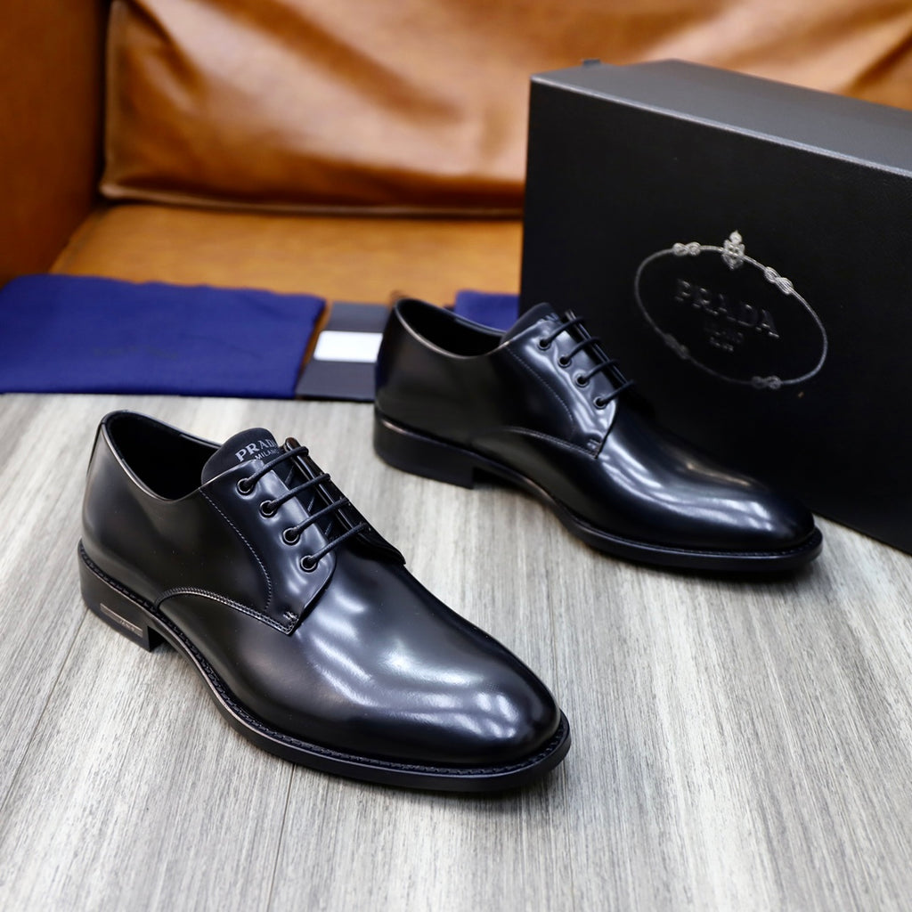 Prada unisex lace-up oxfords in dark leather, front view with black laces.