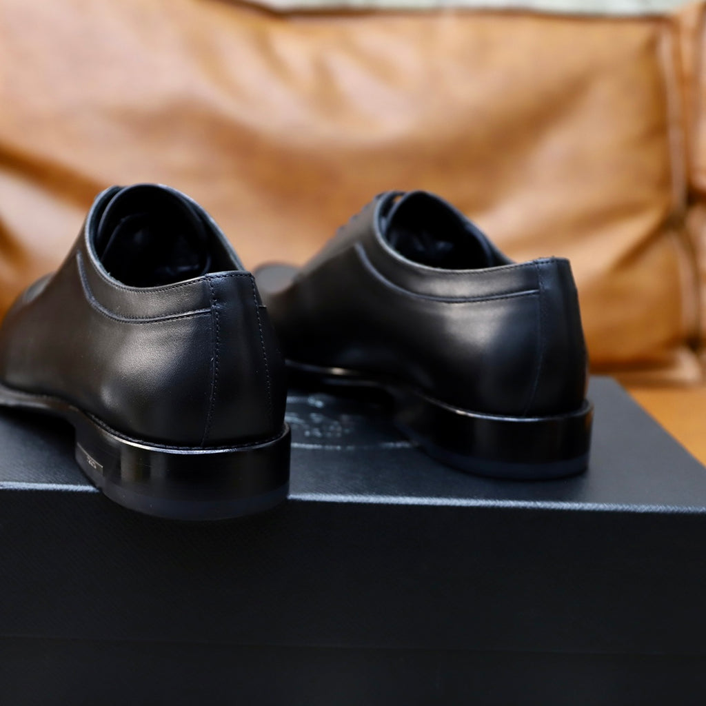 Prada black leather lace-up oxford shoe, rear view showing heel and collar