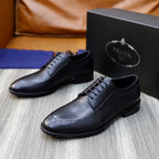 Prada black leather lace-up oxford shoes, front pair with stitched upper details