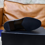 Prada black leather oxford shoe, outsole view on display box