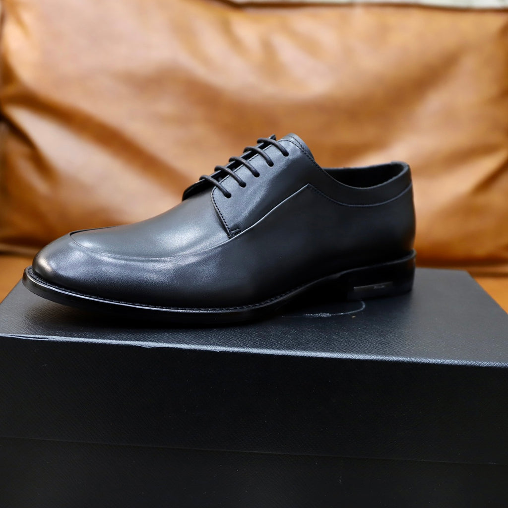 Prada black leather lace-up oxford shoe, single front profile on display box