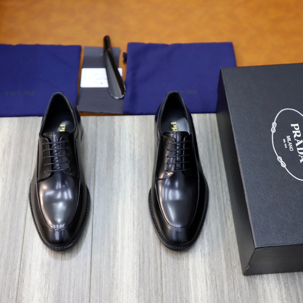 Black leather oxford shoes with lace-up front and cushioned sole.