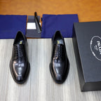 Black leather oxford shoes with lace-up front and cushioned sole.