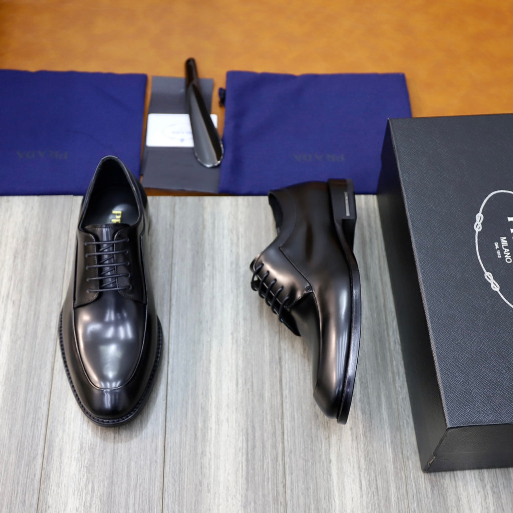 Black leather lace-up oxford shoes, side profile with low stacked heel.