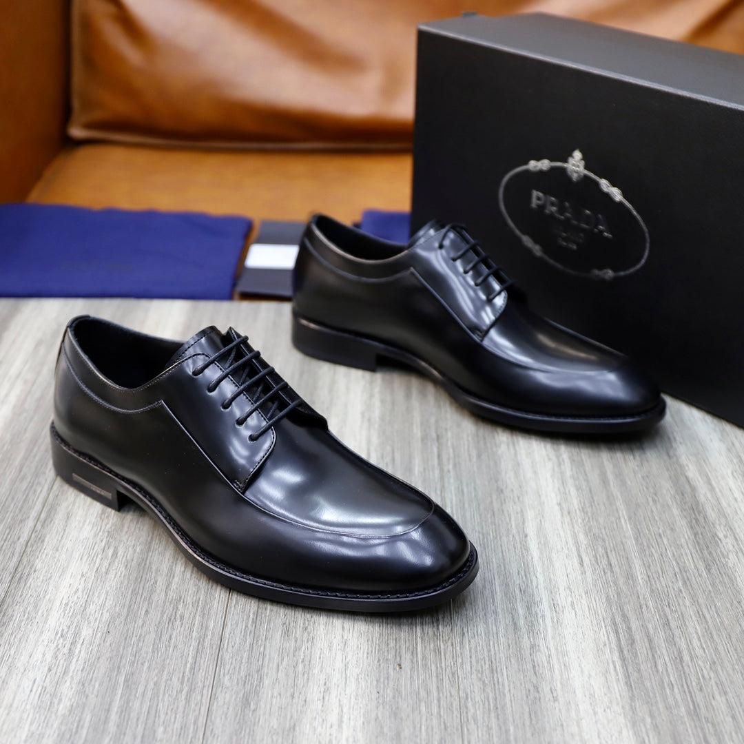 Black leather oxford shoes with classic lace-up and rounded toe.