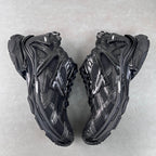 Balenciaga unisex chunky sneakers, black with metallic panels and lace-up design.