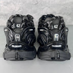 Balenciaga unisex sneakers back view, black heels with BALENCIAGA logo and size 42.