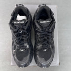 Balenciaga unisex sneakers front view, black uppers with BALENCIAGA tongue branding.