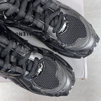 Balenciaga unisex sneaker toe and lace detail, black mesh upper and rubber trim.