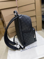 Men’s black monogram backpack with front flap pocket and adjustable shoulder straps