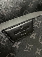Louis Vuitton embossed logo label on black monogram leather-look panel