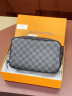 Louis Vuitton bag in dark gray checkered canvas with a top zip and rounded shape