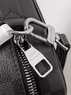 Louis Vuitton bag hardware with silver clasp, zipper pulls, and leather tag