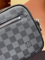 Louis Vuitton small bag close-up of Damier checker fabric with zipper track and stitching