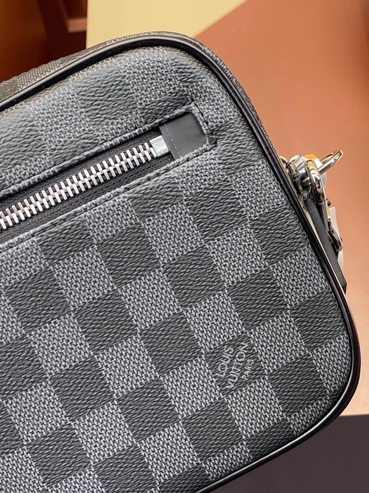 Louis Vuitton small bag close-up of Damier checker fabric with zipper track and stitching