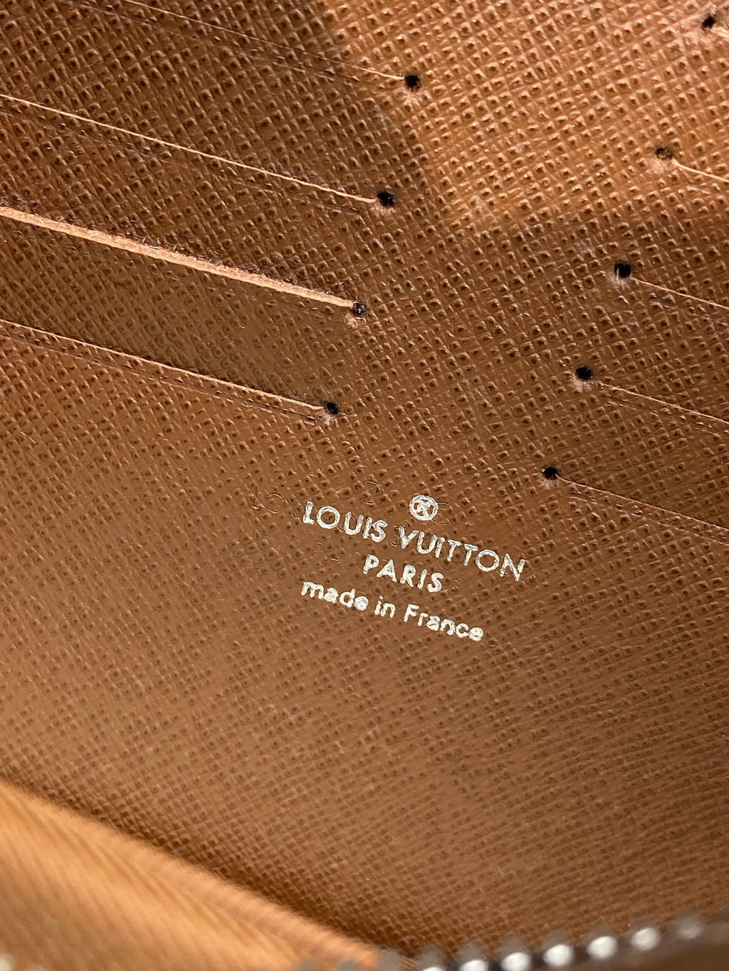 Louis Vuitton small bag leather base with embossed text 'Paris' and 'made in France'