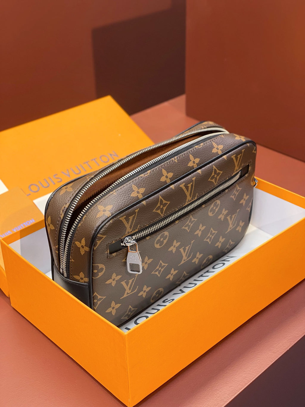 Louis Vuitton small bag with brown monogram canvas and silver zipper hardware