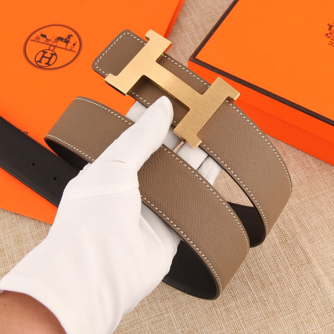 Hermes leather belt with silver H buckle, taupe strap and dark keeper