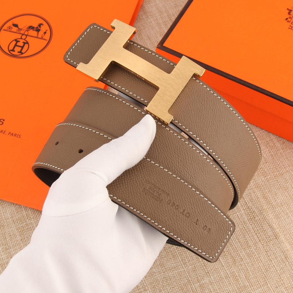 Hermes leather belt, taupe strap with silver H buckle and punched holes