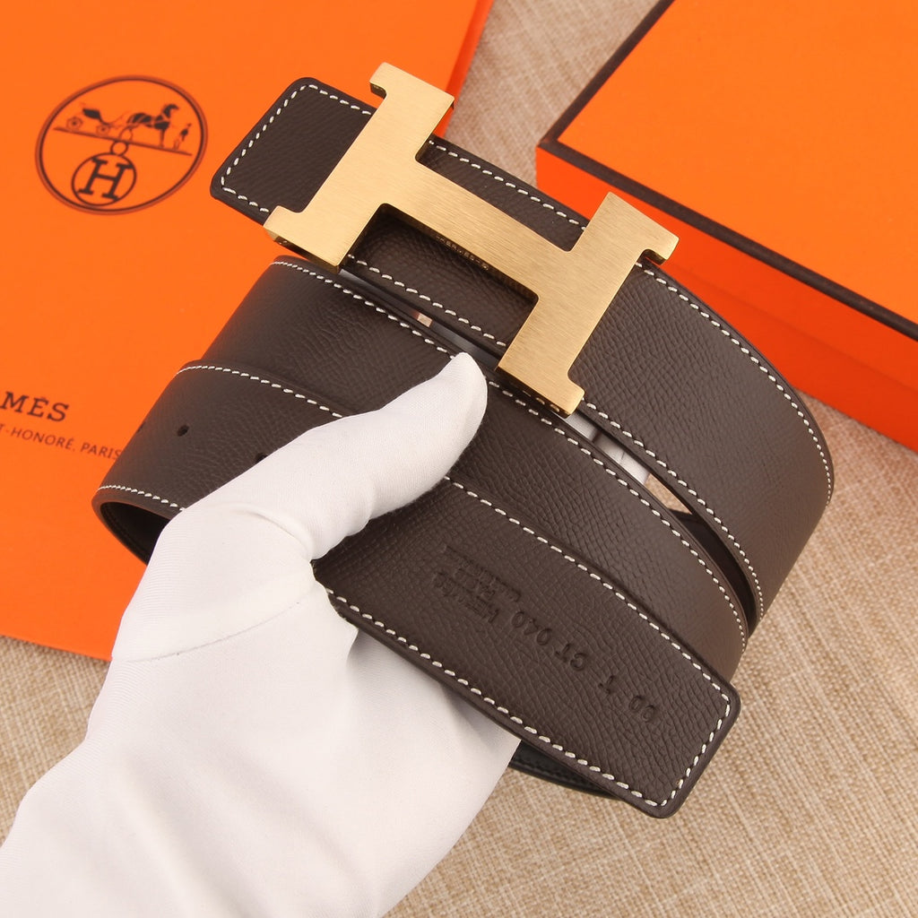 Hermes belt front view with dark brown leather, silver H buckle, and white contrast stitching