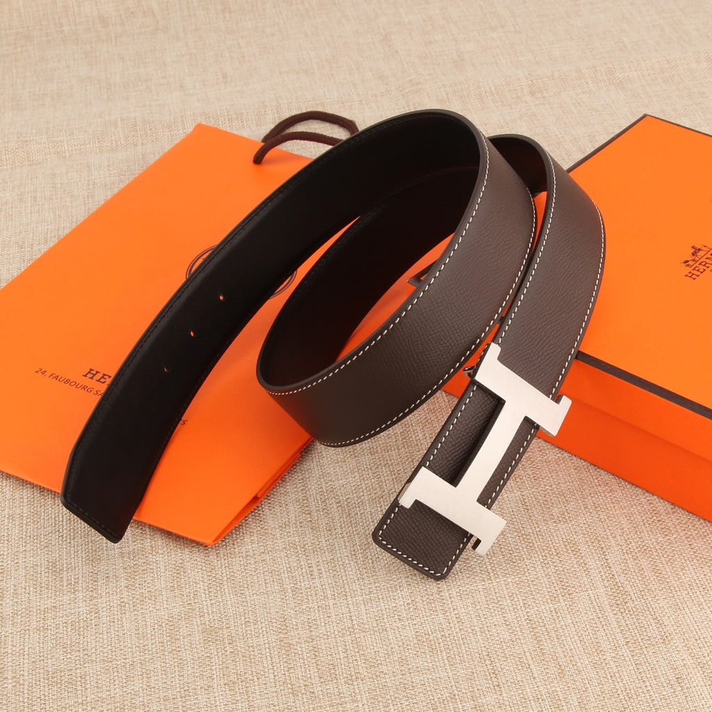 Hermes leather belt with silver-tone buckle, white topstitching, and dark brown strap