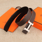 Hermes leather belt with silver-tone buckle, white topstitching, and dark brown strap